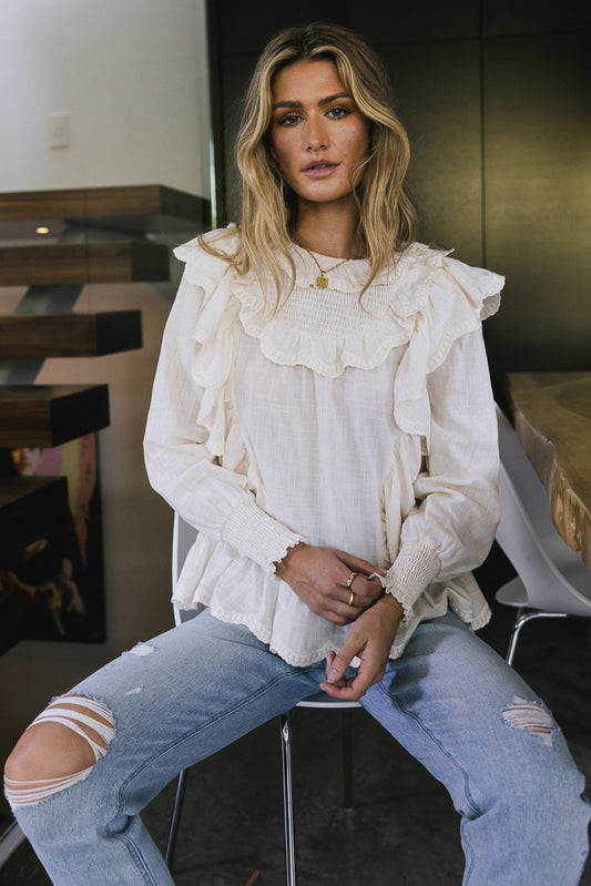ivory ruffle blouse with long sleeves