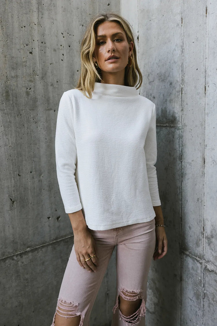 3/4 sleeves mock neck top in white 