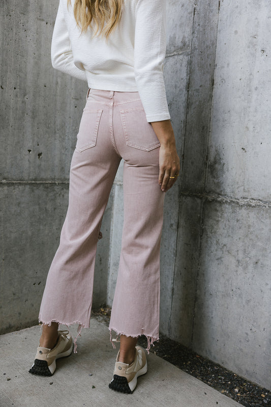 pink distressed denim jeans 