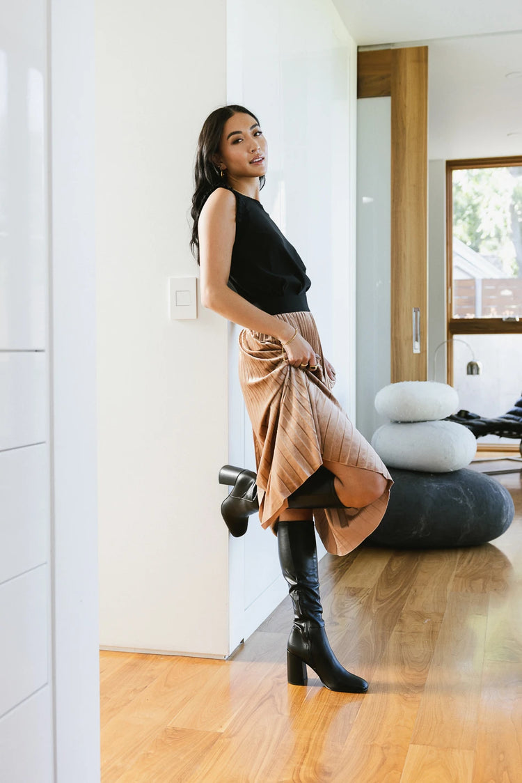 Velvet skirt in tape paired with a black tank top 