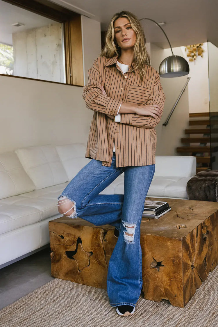 Striped button up in brown paired with a medium light denim 