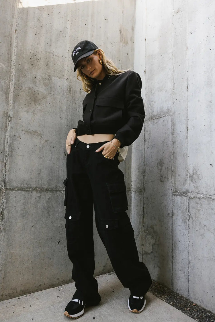 Bomber jacket in black paired with a cargo pant 