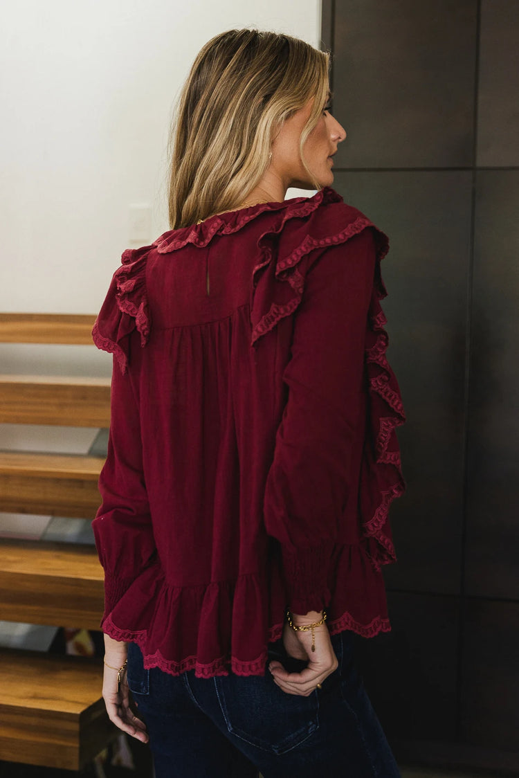 Back ruffle details blouse in burgundy 