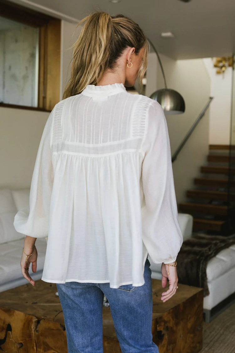 Flowy back style blouse in cream 