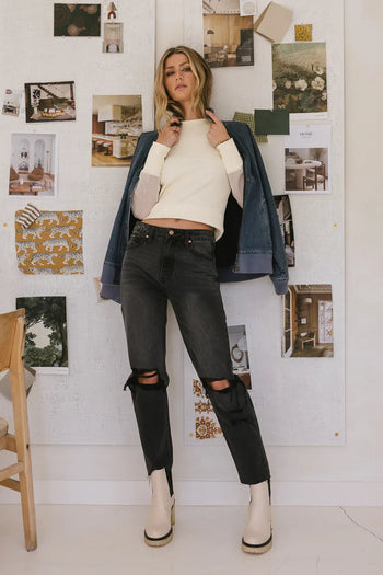 Distressed denim paired with a dark denim jacket 