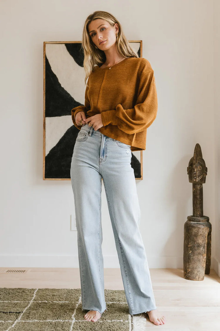 Knit top paired with a wide leg denim 