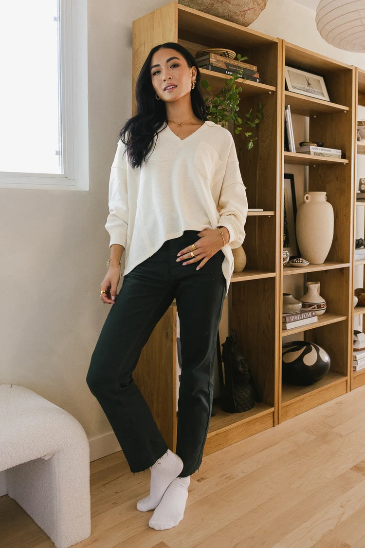 Straight leg jeans paired with a cream top