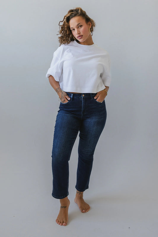 Straight legs paired with a white cropped top 