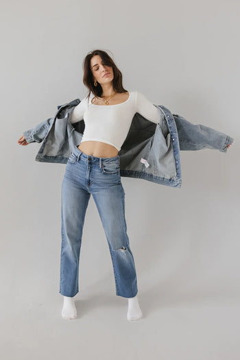 High rise distressed jeans in medium wash 