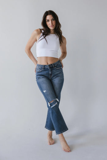 Distressed straight leg jeans in medium wash 