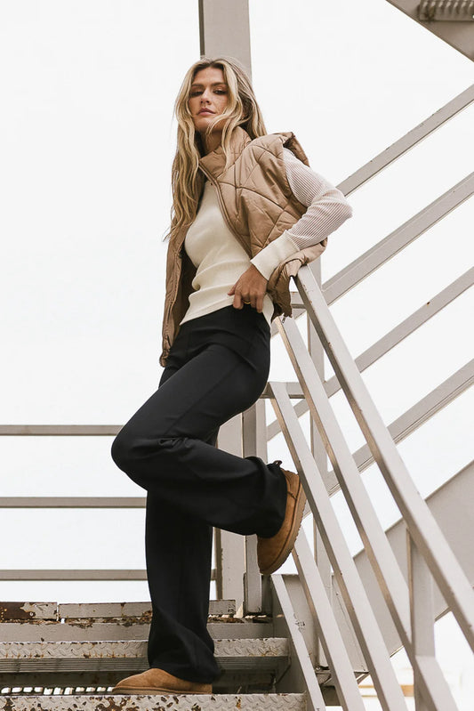 Puffer vest in mocha paired with an active pant  