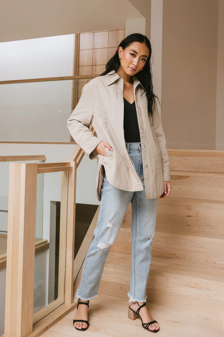 Two side pockets jacket in taupe paired with light denim jeans 