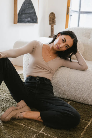 Cropped top in mocha paired with black denim jeans 