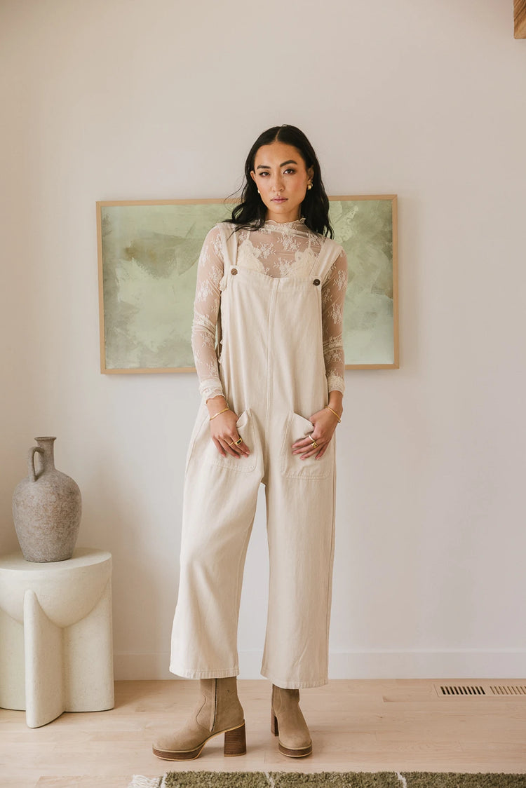 Lace top paired with a cream jumpsuit 