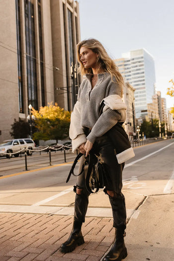 Vest in black paired with a distressed black denim 