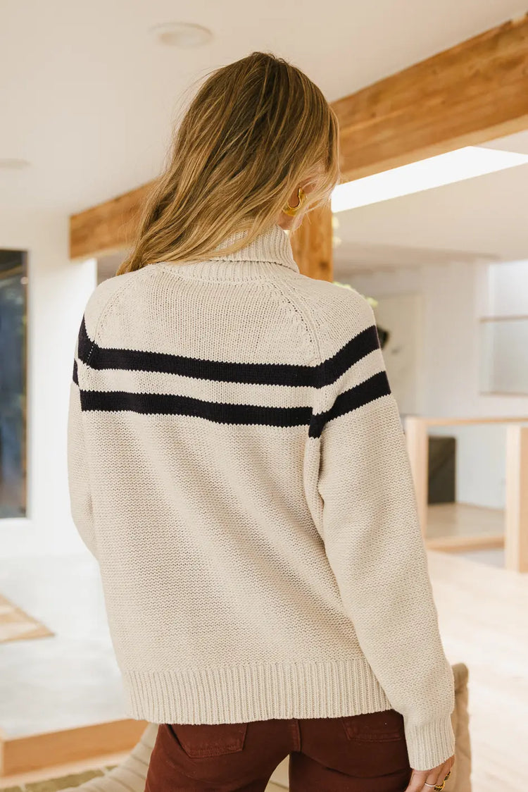 Knit turtleneck sweater in cream 