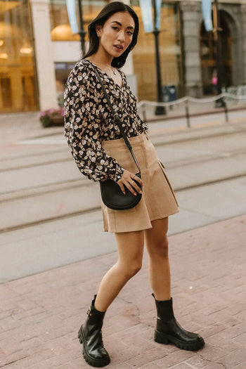 Skirt in khaki paired with a floral top 