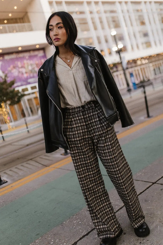 Plaid pants paired with a moto jacket 
