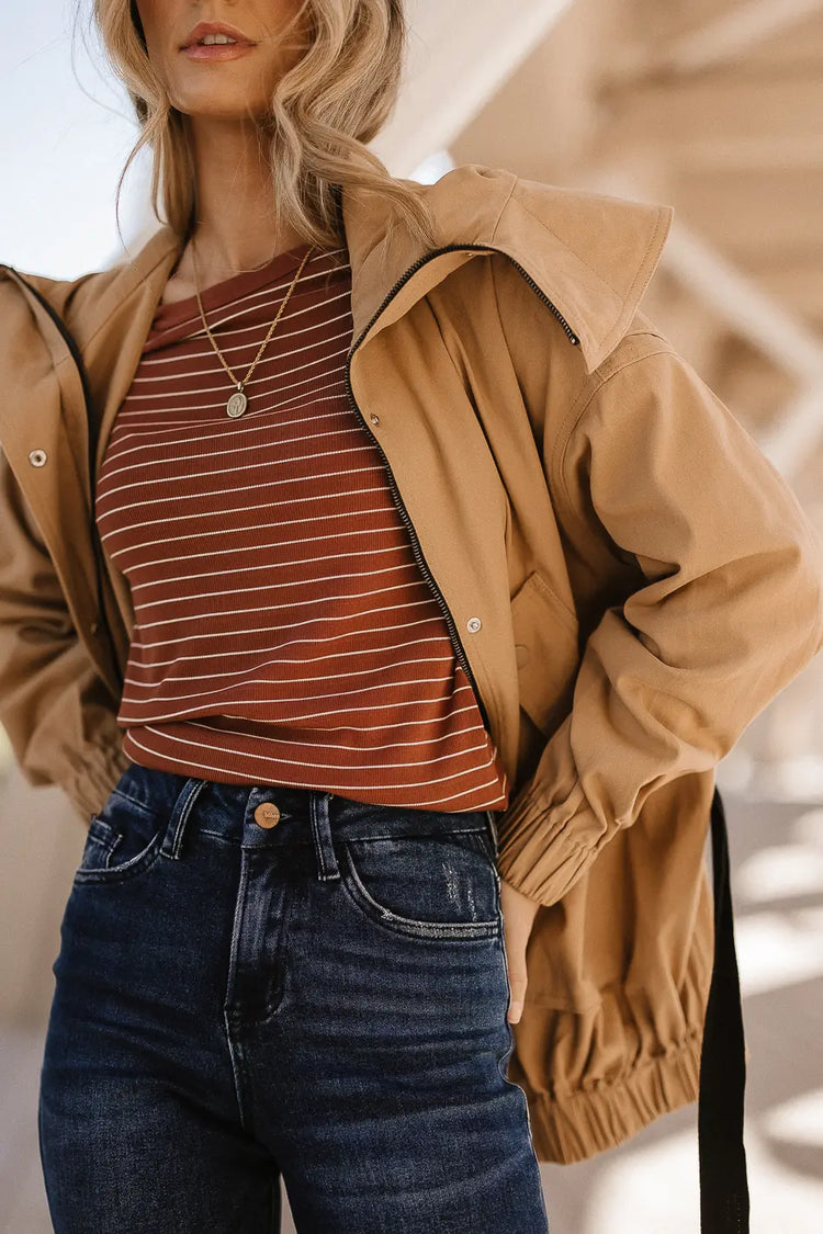 Striped top paired with a dark wash denim 