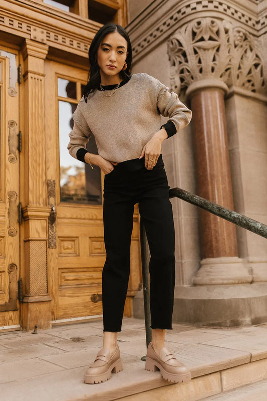 Sweater in brown paired with black jeans 