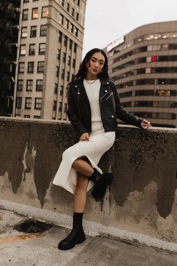 Fuzzy skirt in cream paired with a moto jacket 