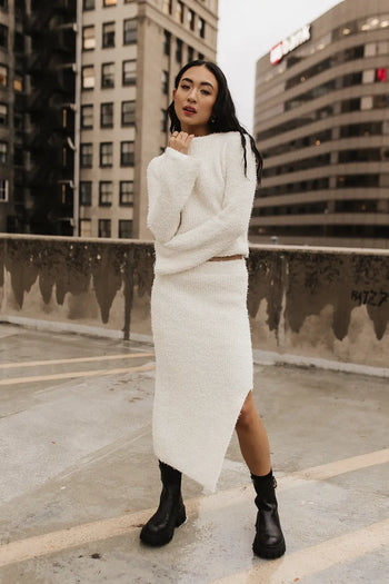 Fuzzy skirt paired with a fuzzy cream sweater 