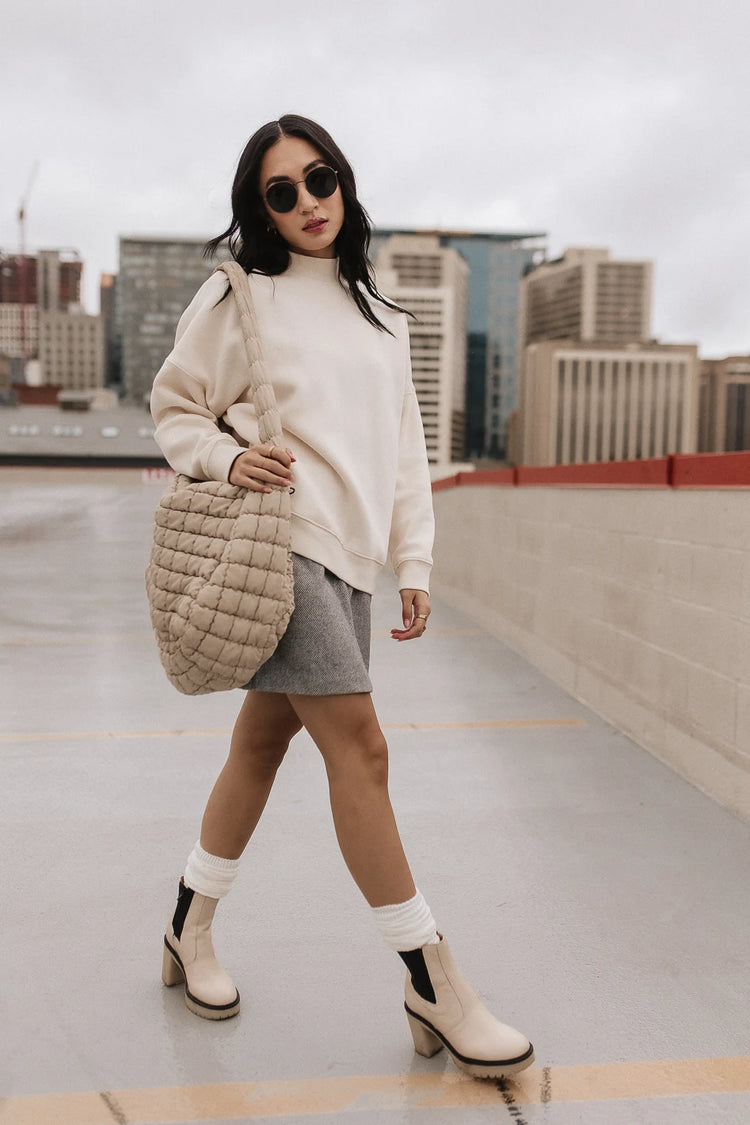 Wool mini skirt in grey paired with a cream sweatshirt 