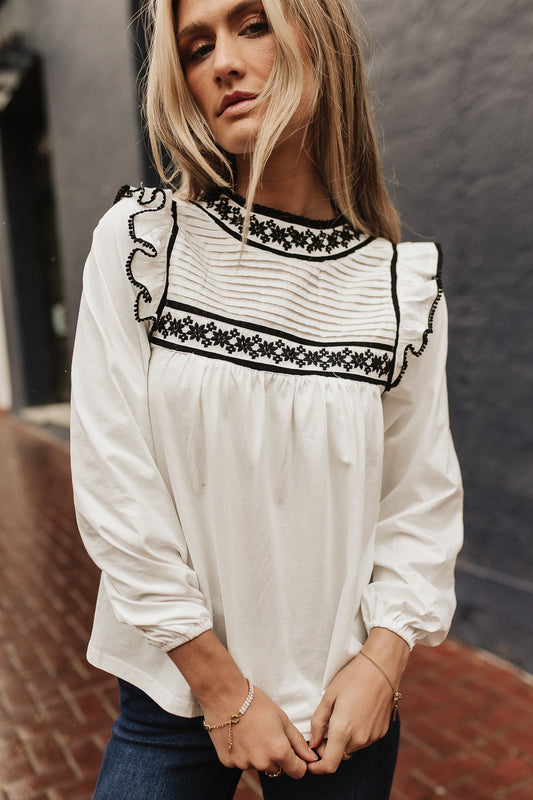 embroidered white blouse with black detail
