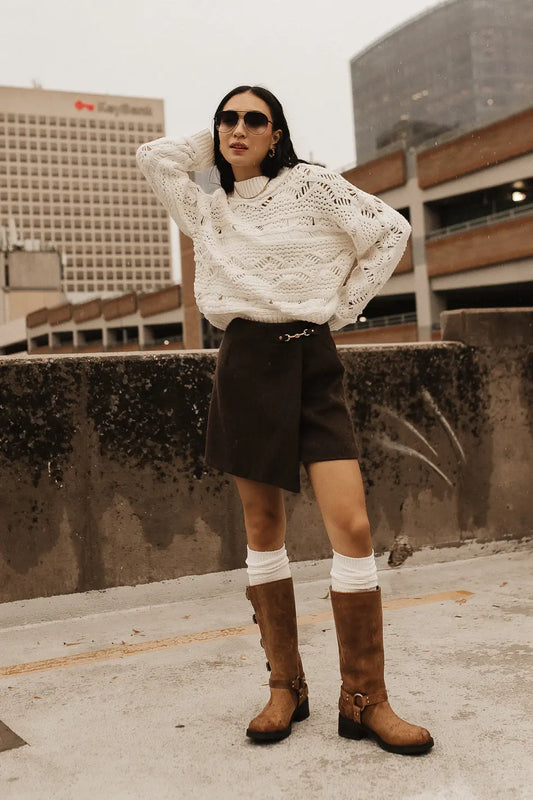 Sweater in cream paired with a brown wool skirt 