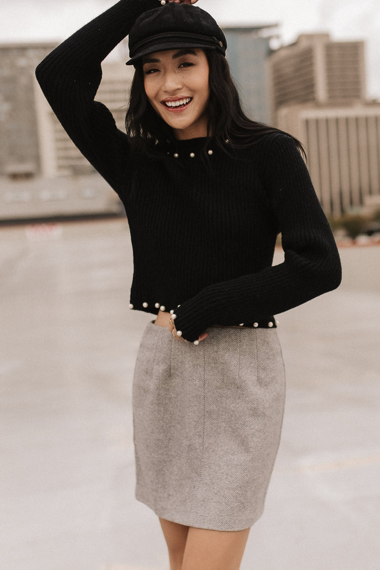 Wool mini skirt in grey paired with a cream sweatshirt