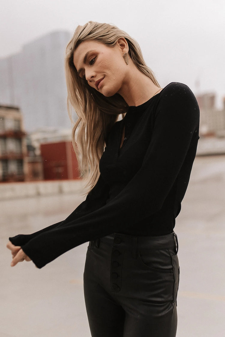 Round neck with button details top in black 