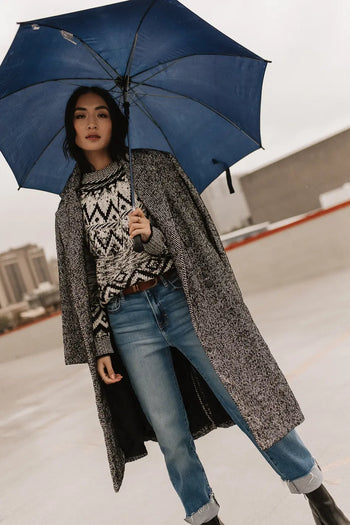 Sweater paired with a light denim 