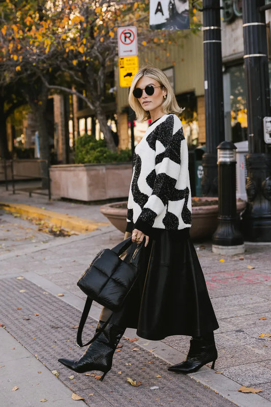 Sweater paired with a maxi leather skirt 