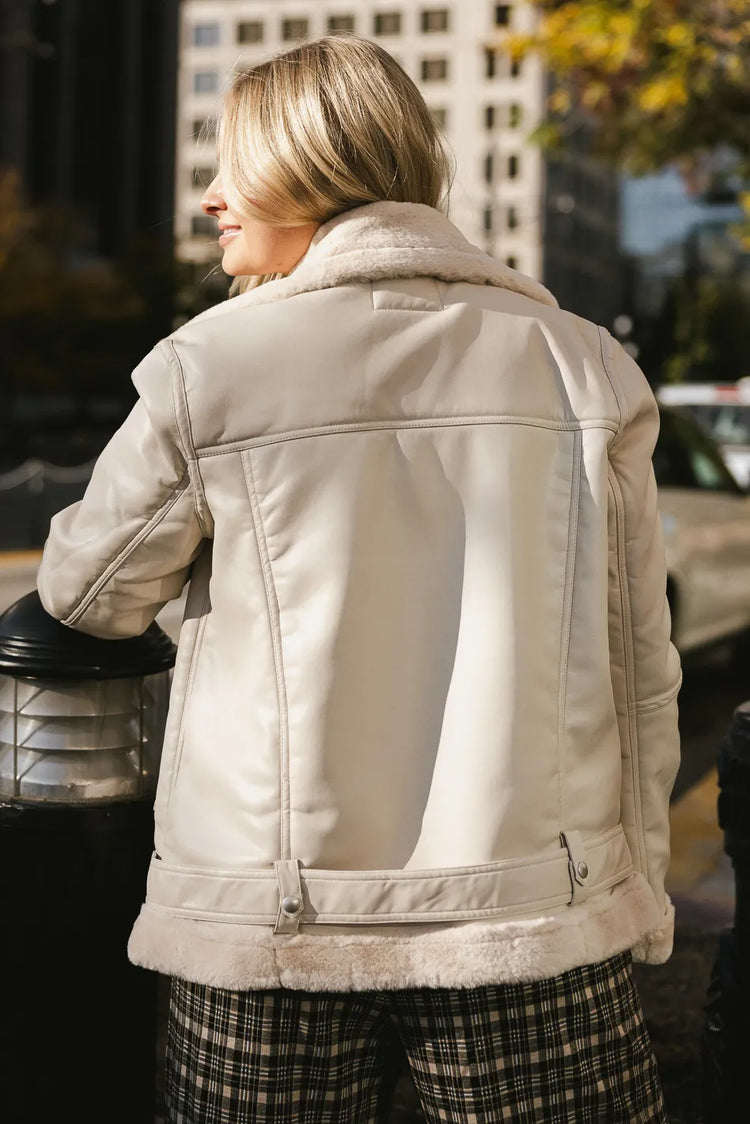Adjustable belt hem vegan leather jacket in cream 