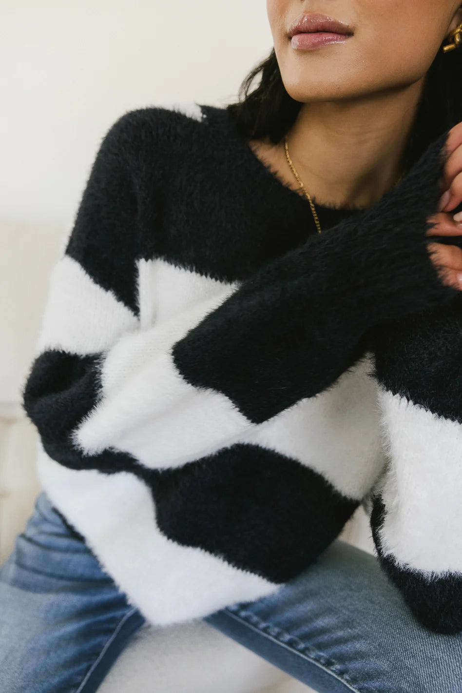 Black and on sale white fuzzy sweater