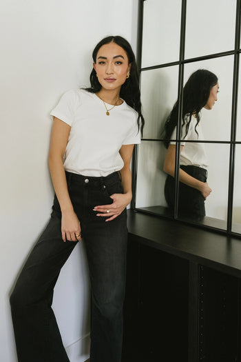 T-Shirt paired with black denim 