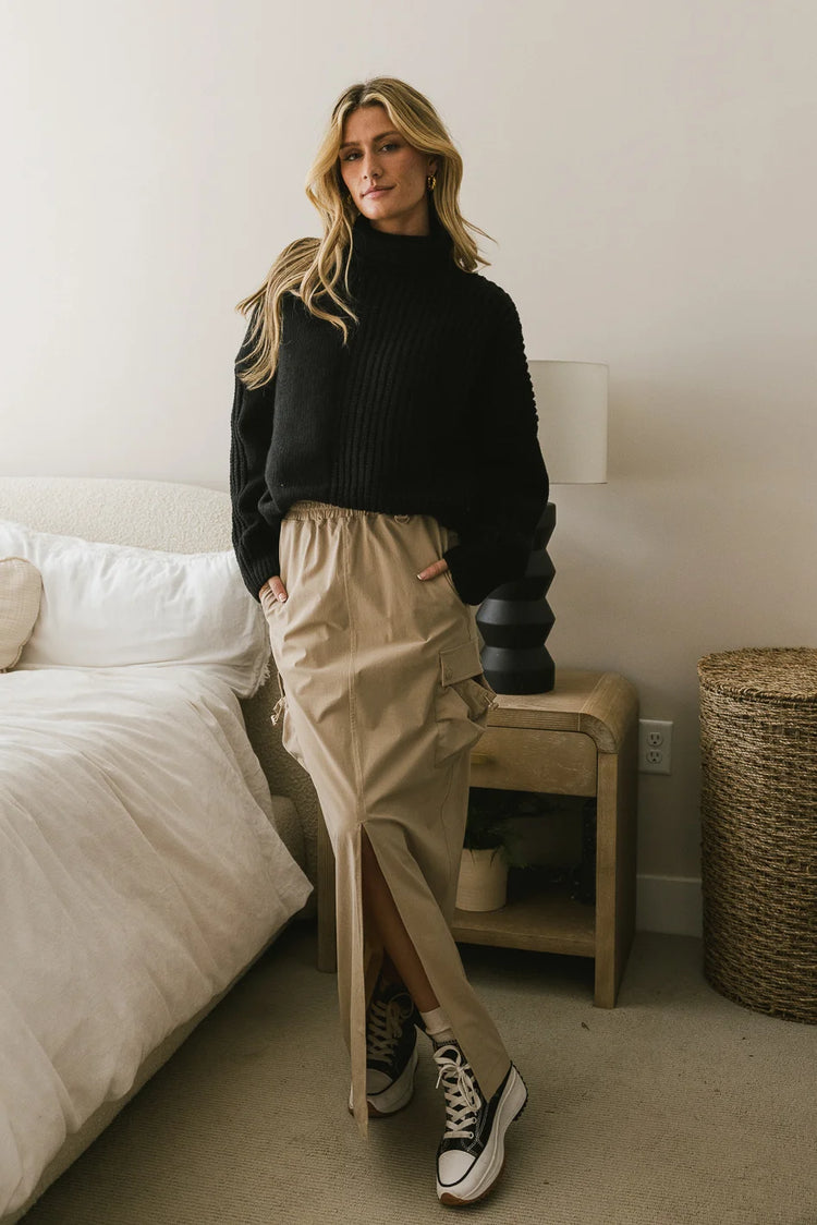 Turtle neck paired with a cargo skirt in taupe