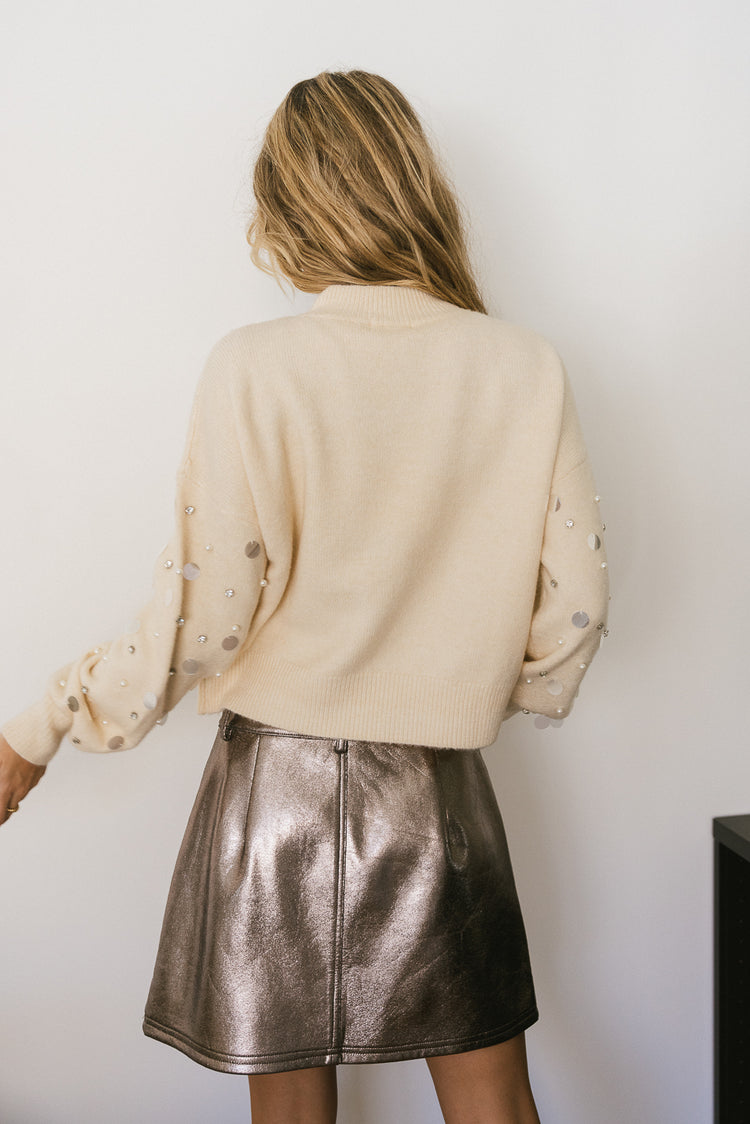 cream sweater with sequin sleeves