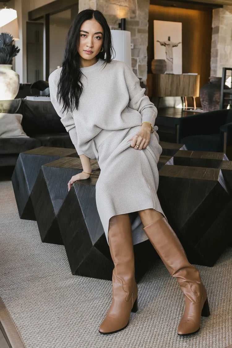 Waffle sweater in taupe paired with a midi skirt 