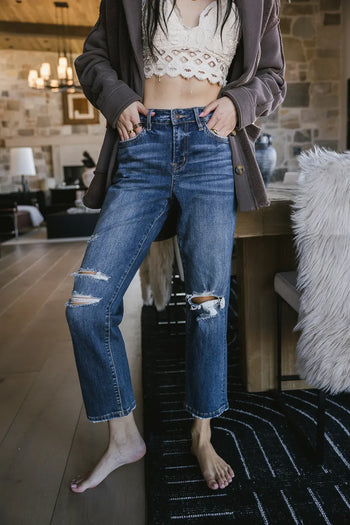Distressed denim in medium wash 