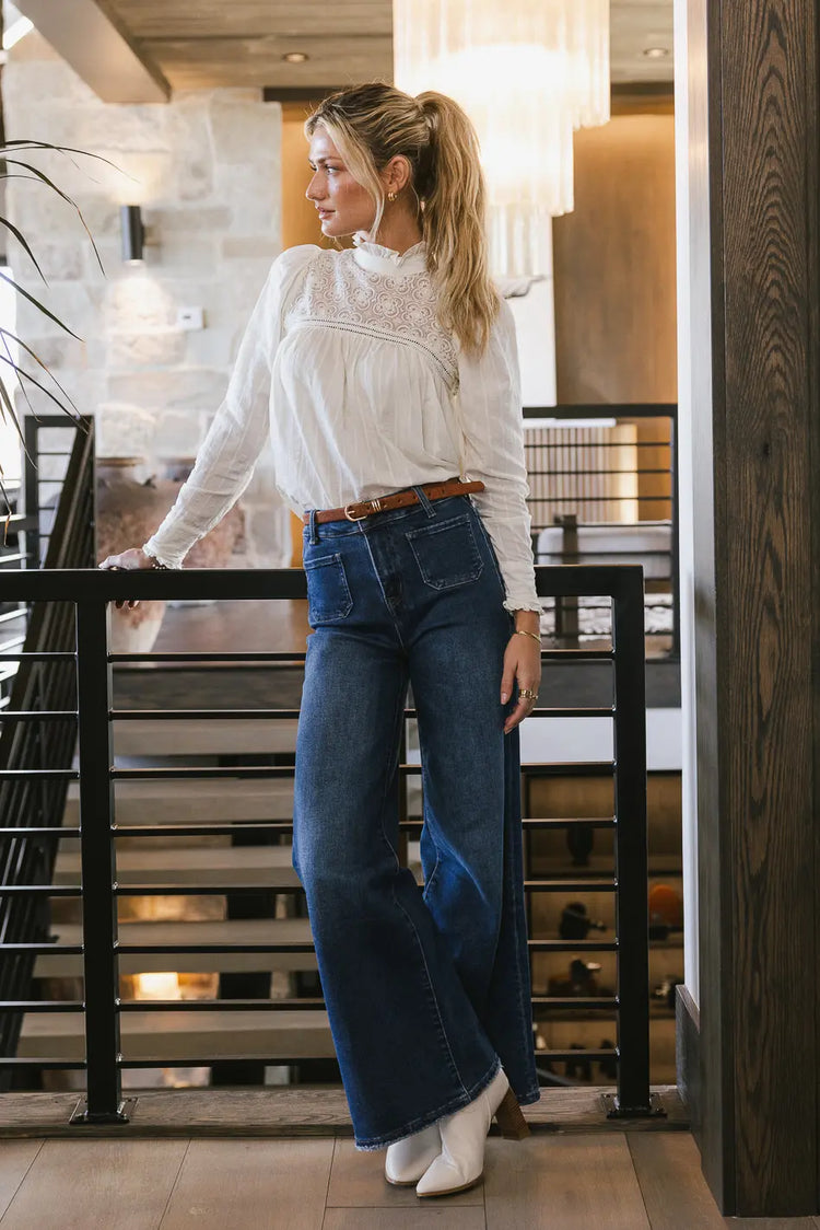 Top in cream paired with a blue denim 