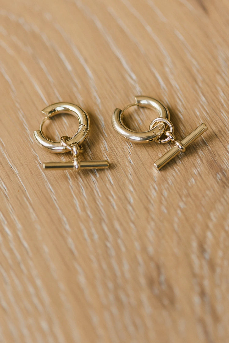 Gold earrings with a pendant design 