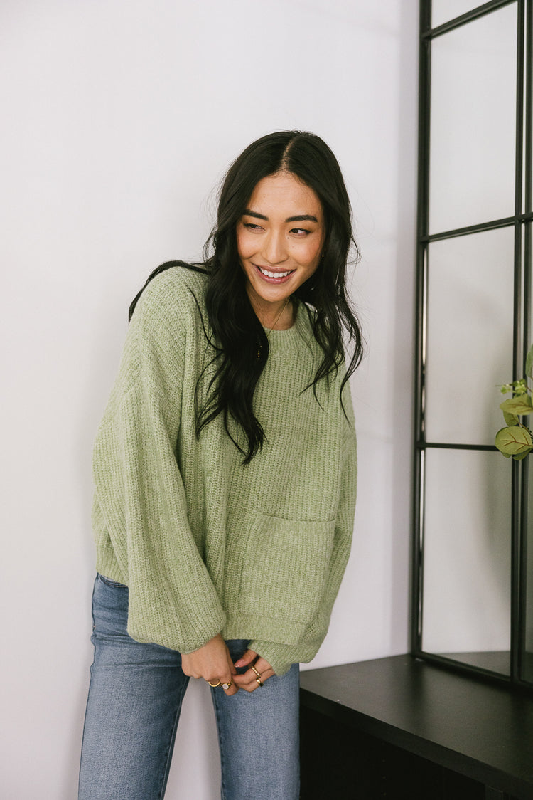 green sweater with pocket