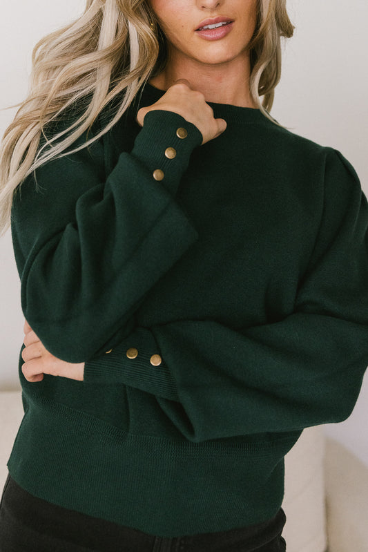green knit sweater with buttons