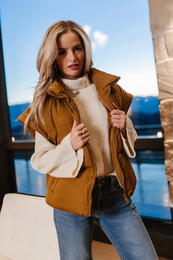 Sweater paired with a vest 