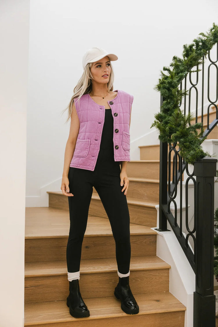 Quilted vest in orchid paired with a onsie in black 