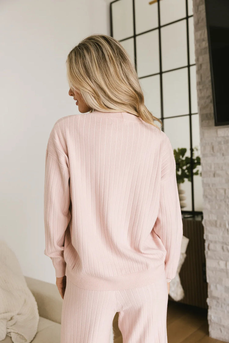 backside of ribbed pink sweater