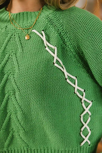 green knit top