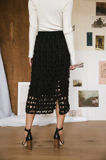 Back hem slit open cage skirt in black 