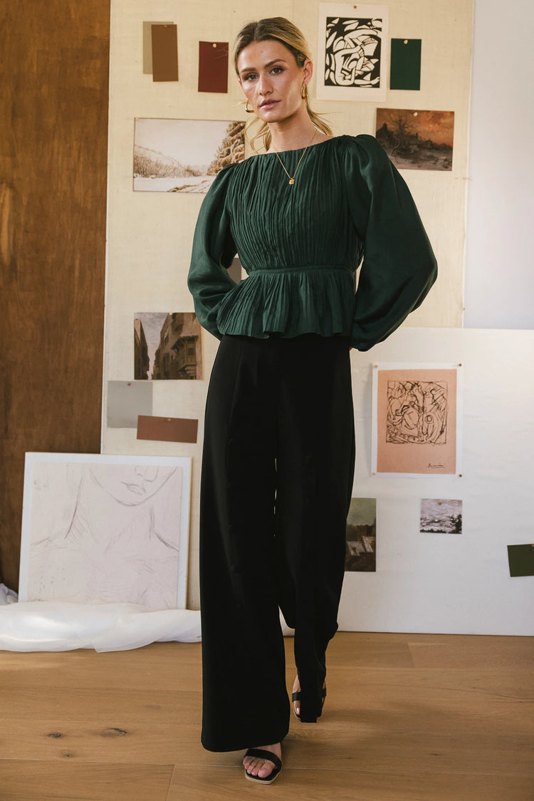 Blouse in green paired with a wide leg pants 